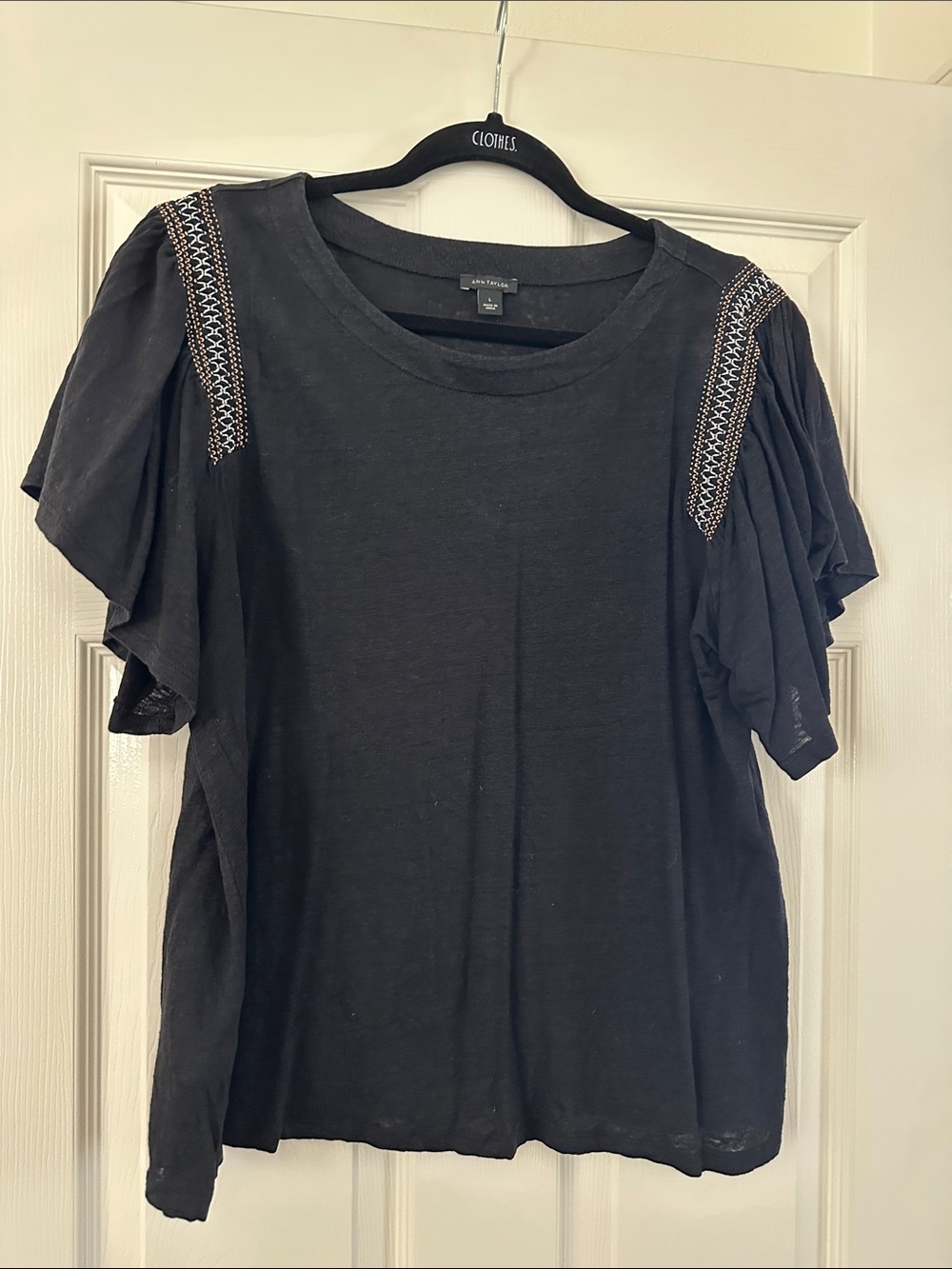 Black t-shirt with smocking detail on the sleeves